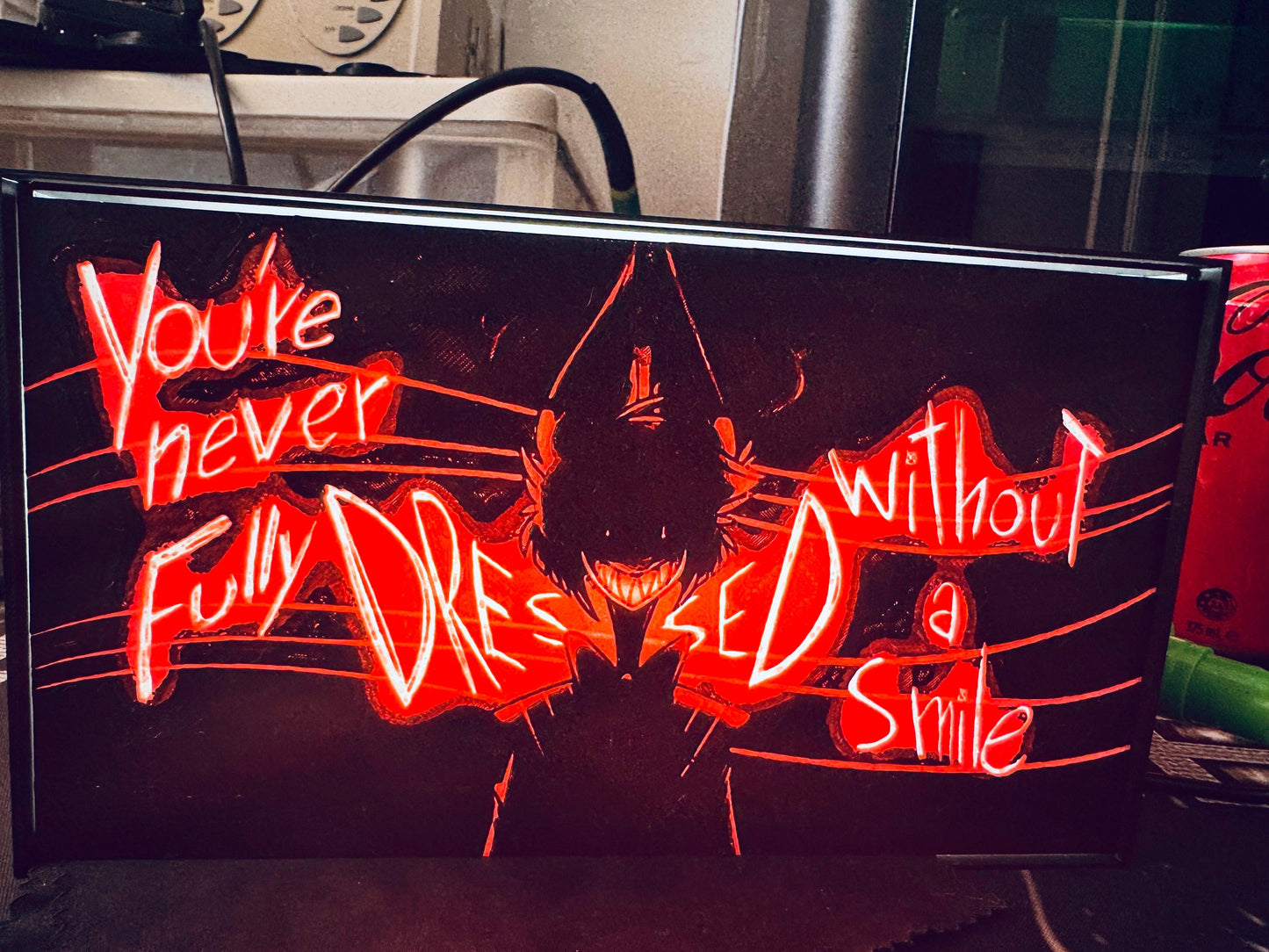 Hazbin Hotel: You're never fully dressed without a Smile! Light up Sign - Michael's 3D World