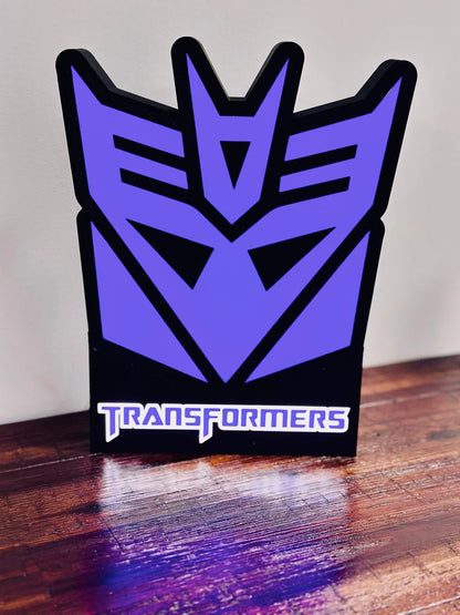 Transformers: Logotipos de Decepticon y Autobots: ¡Letreros iluminados!