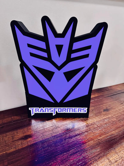 Transformers: Logotipos de Decepticon y Autobots: ¡Letreros iluminados!